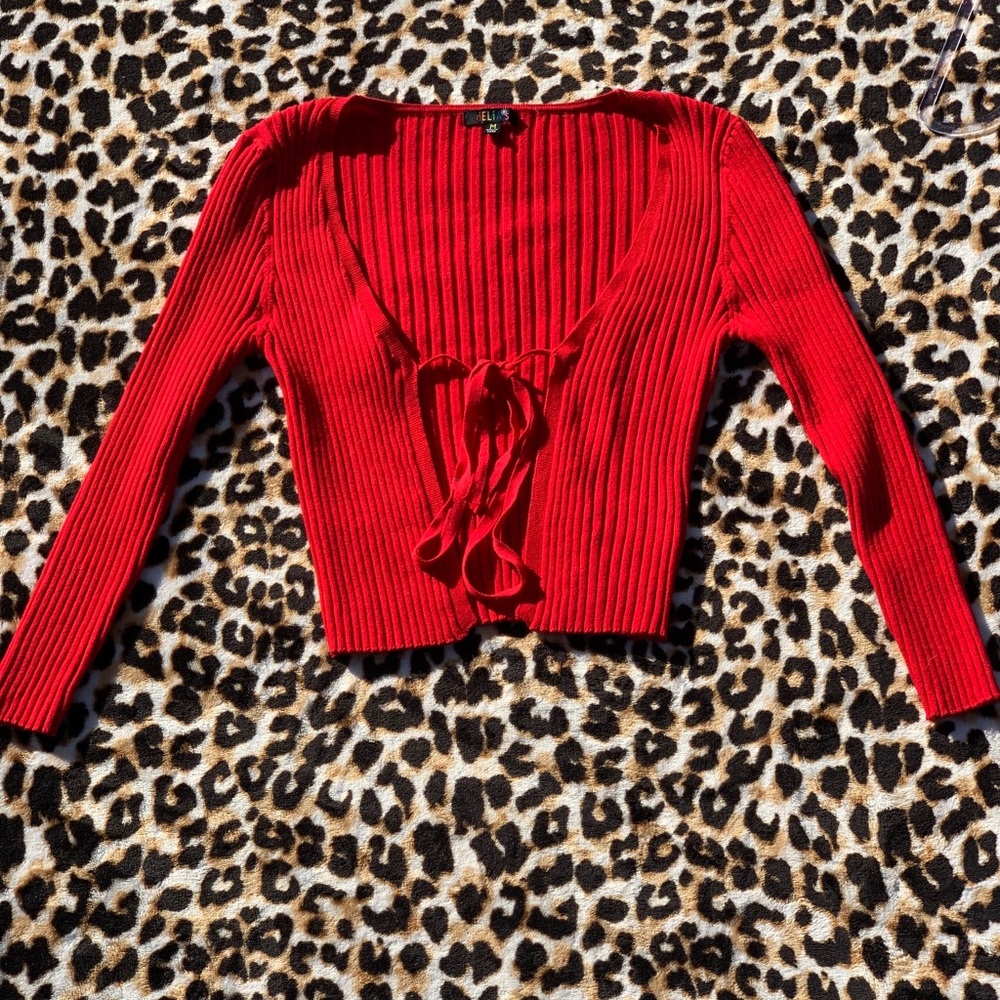 Burn I’m an open book ribbed sweater.